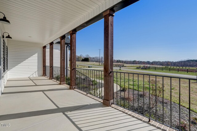 balcony featuring a rural view