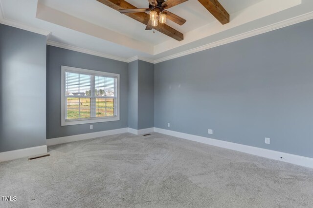 spare room with visible vents, beamed ceiling, carpet, baseboards, and a ceiling fan