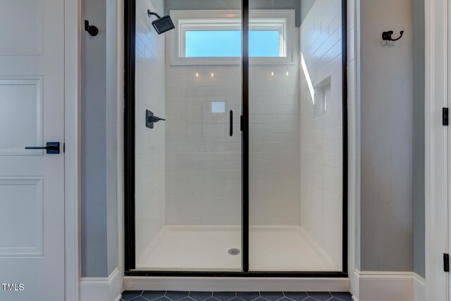 full bath featuring a shower stall