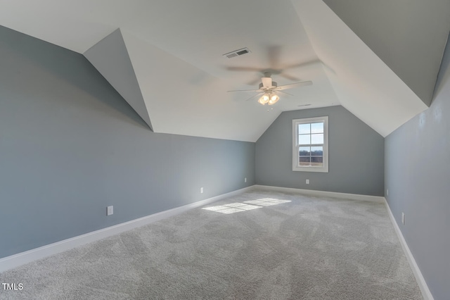 bonus room with lofted ceiling, baseboards, visible vents, ceiling fan, and carpet