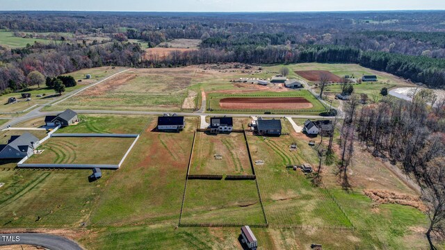bird's eye view with a rural view and a view of trees