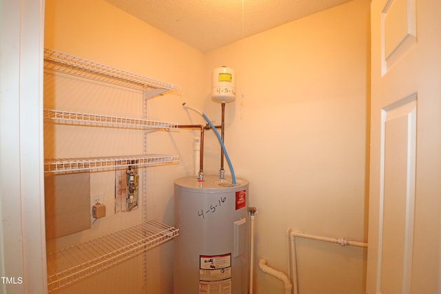 utility room featuring electric water heater