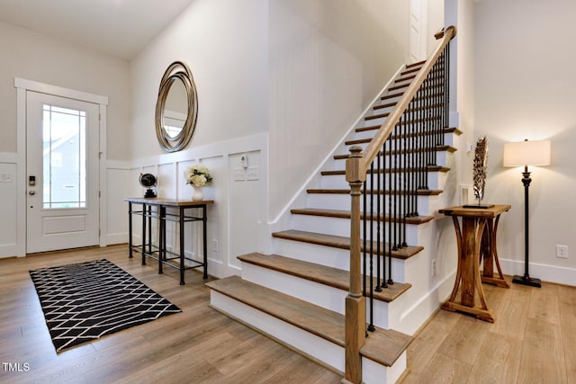 367 Gilliland Rd, Siler City, NC 27344 - foyer with a wainscoted wall, wood finished floors, and stairway