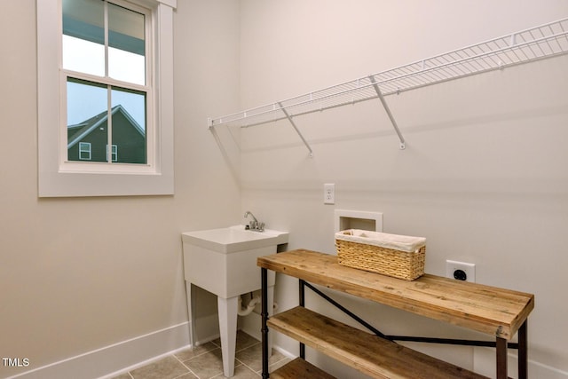 367 Gilliland Rd, Siler City, NC 27344 - washroom with light tile patterned flooring, hookup for an electric dryer, baseboards, and laundry area