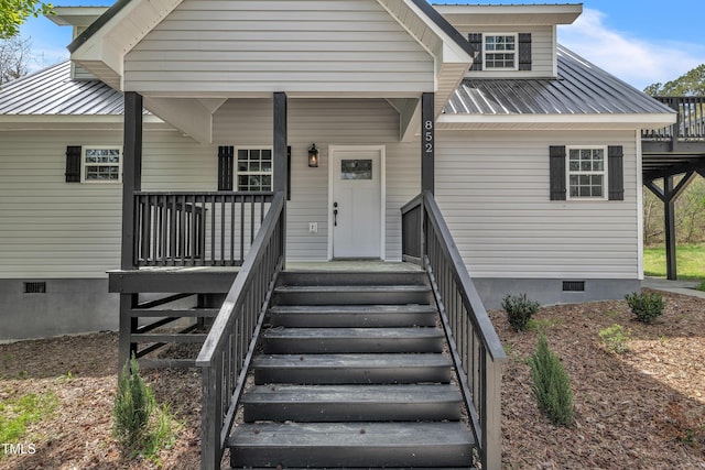 852 Fred Wilder Rd, Franklinton, NC 27525 - view of front facade featuring crawl space, metal roof, and a porch