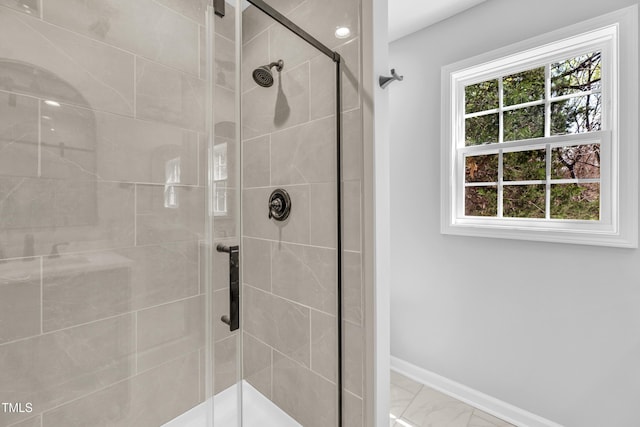 852 Fred Wilder Rd, Franklinton, NC 27525 - bathroom featuring a stall shower, baseboards, and marble finish flooring