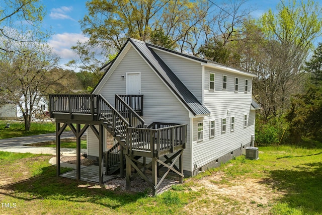 852 Fred Wilder Rd, Franklinton, NC 27525 - rear view of property featuring a deck, crawl space, stairway, central air condition unit, and a yard