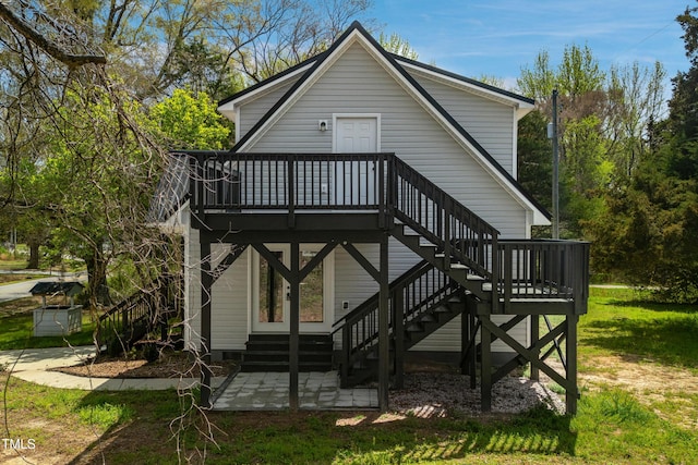 852 Fred Wilder Rd, Franklinton, NC 27525 - back of property featuring a patio, a wooden deck, and stairs