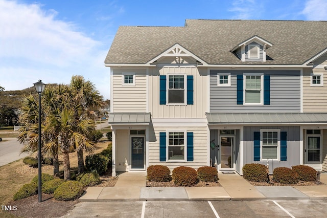 2800 W Ft Macon Rd Unit 56, Atlantic Beach, NC 28512 - view of property featuring a shingled roof, uncovered parking, and board and batten siding