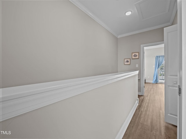 2800 W Ft Macon Rd Unit 56, Atlantic Beach, NC 28512 - corridor featuring attic access, baseboards, light wood finished floors, and ornamental molding