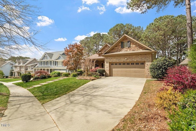 1525 Marshall Farm St, Wake Forest, NC 27587 - view of front of property featuring brick siding, a front yard, driveway, and a garage