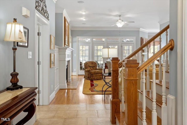 1525 Marshall Farm St, Wake Forest, NC 27587 - foyer with stairway, a ceiling fan, a fireplace with raised hearth, baseboards, and ornamental molding