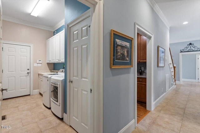 1525 Marshall Farm St, Wake Forest, NC 27587 - washroom featuring washing machine and clothes dryer, cabinet space, crown molding, and baseboards