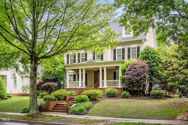 3821 Falls River Ave, Raleigh, NC 27614 - view of front facade with a porch, stairs, a shingled roof, and a front lawn
