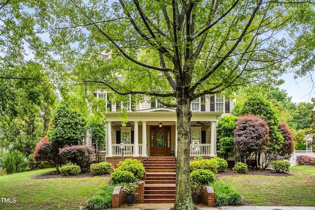 3821 Falls River Ave, Raleigh, NC 27614 - view of front of house featuring a ceiling fan, a porch, stairway, and a front lawn