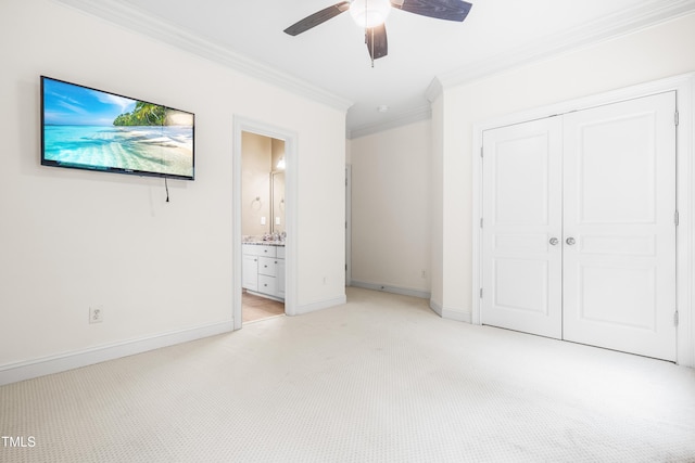 3821 Falls River Ave, Raleigh, NC 27614 - unfurnished bedroom with crown molding, a closet, light colored carpet, baseboards, and ceiling fan