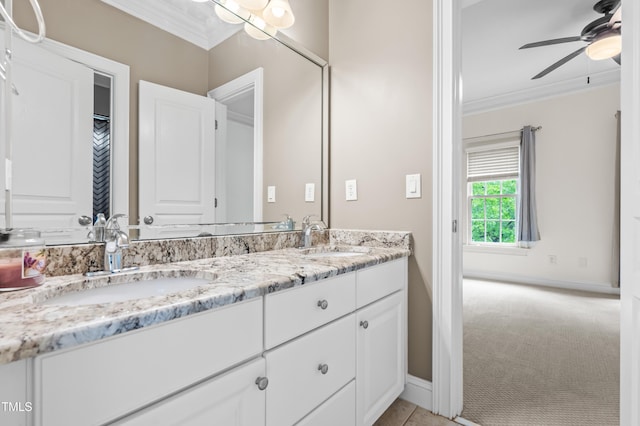 3821 Falls River Ave, Raleigh, NC 27614 - bathroom featuring ornamental molding, a ceiling fan, double vanity, and baseboards
