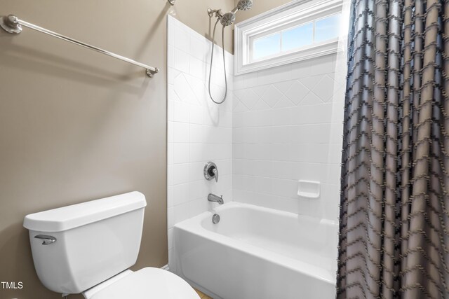 3821 Falls River Ave, Raleigh, NC 27614 - bathroom with toilet and shower / tub combo with curtain