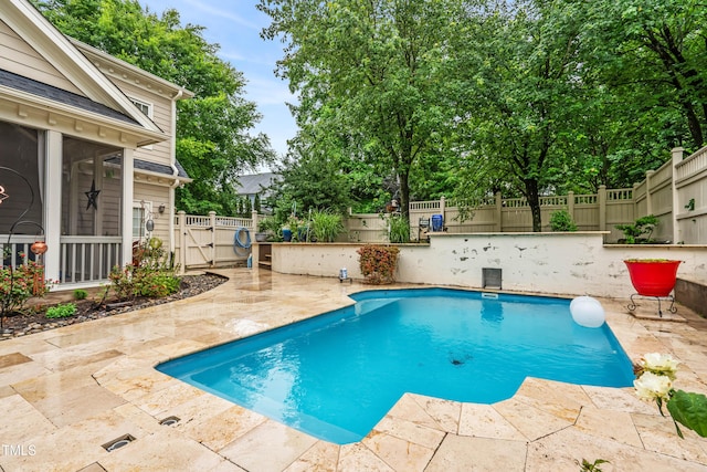 3821 Falls River Ave, Raleigh, NC 27614 - view of swimming pool featuring a patio, a fenced backyard, and a gate