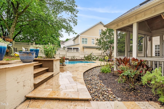 3821 Falls River Ave, Raleigh, NC 27614 - view of patio / terrace with a sunroom and a fenced backyard