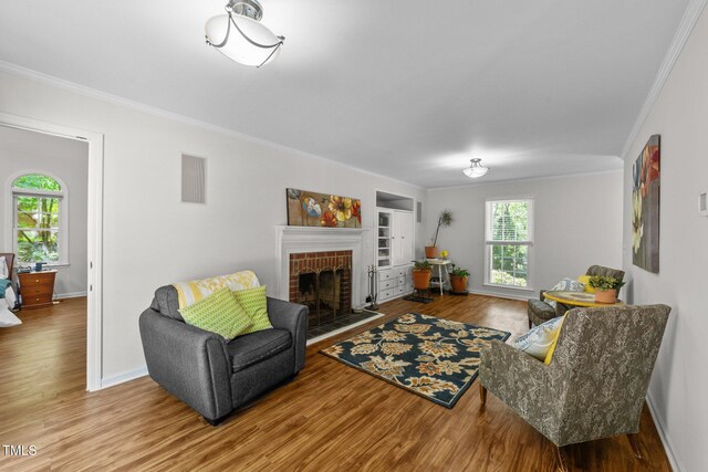 63 Tally Ho Dr, Selma, NC 27576 - living room featuring ornamental molding, wood finished floors, built in shelves, and baseboards