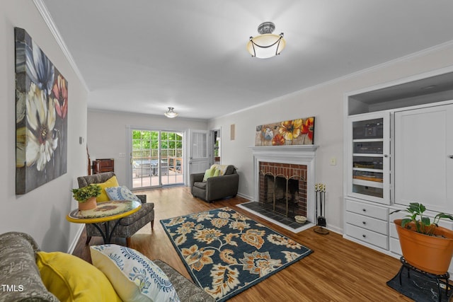 63 Tally Ho Dr, Selma, NC 27576 - living area with a fireplace, wood finished floors, crown molding, and baseboards