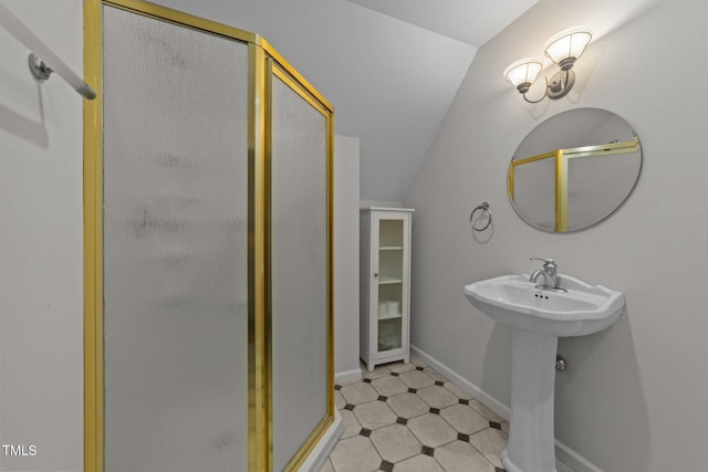 63 Tally Ho Dr, Selma, NC 27576 - bathroom with lofted ceiling, a shower stall, and a sink