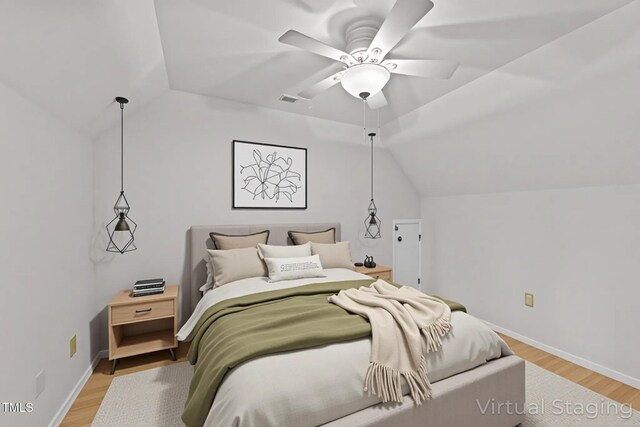 63 Tally Ho Dr, Selma, NC 27576 - bedroom featuring vaulted ceiling, light wood-style floors, a ceiling fan, and baseboards