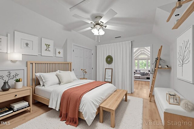 63 Tally Ho Dr, Selma, NC 27576 - bedroom with light wood finished floors, a ceiling fan, a closet, and vaulted ceiling