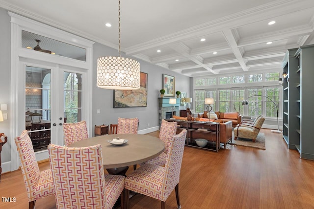417 Westbury Dr, Chapel Hill, NC 27516 - dining room featuring beamed ceiling, coffered ceiling, wood finished floors, and a fireplace