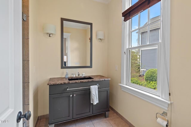417 Westbury Dr, Chapel Hill, NC 27516 - bathroom with a wealth of natural light, tile patterned flooring, vanity, and baseboards