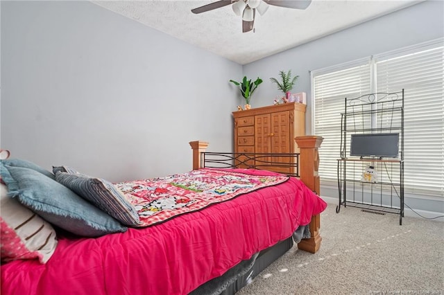 1010 Blue Wren Dr, Fayetteville, NC 28312 - carpeted bedroom featuring a ceiling fan and a textured ceiling
