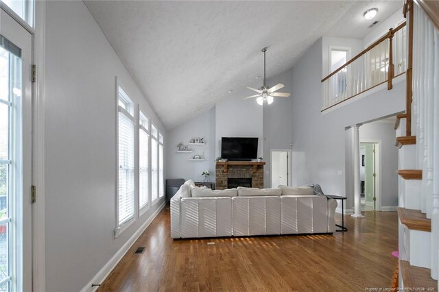 6826 Surrey Rd, Fayetteville, NC 28306 - living room featuring baseboards, a fireplace, wood finished floors, and a ceiling fan