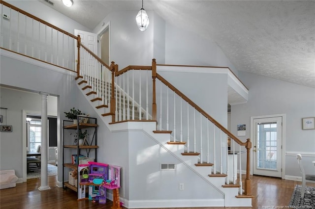 6826 Surrey Rd, Fayetteville, NC 28306 - stairway with a wealth of natural light, visible vents, and wood finished floors