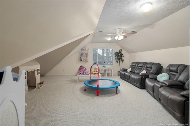 6826 Surrey Rd, Fayetteville, NC 28306 - recreation room featuring lofted ceiling, carpet, a textured ceiling, visible vents, and a ceiling fan