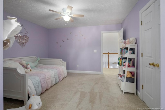 6826 Surrey Rd, Fayetteville, NC 28306 - bedroom featuring a ceiling fan, carpet floors, baseboards, and a textured ceiling