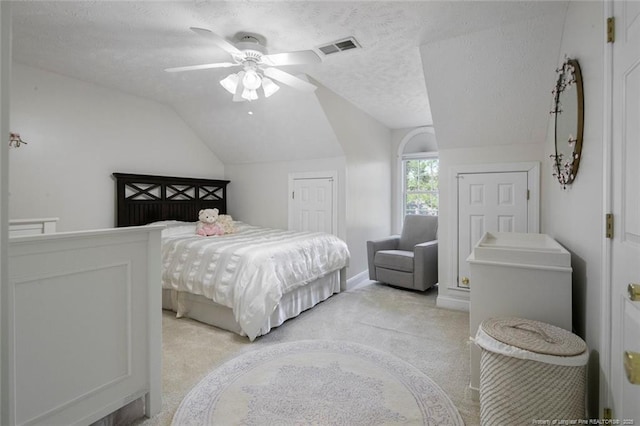 6826 Surrey Rd, Fayetteville, NC 28306 - bedroom featuring light carpet, a textured ceiling, lofted ceiling, and visible vents