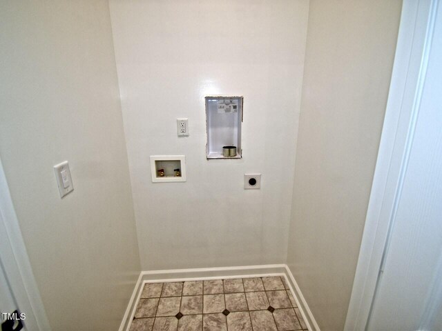 laundry area featuring baseboards, hookup for an electric dryer, laundry area, and washer hookup