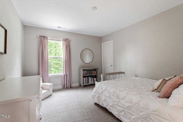 bedroom with carpet floors, baseboards, and visible vents