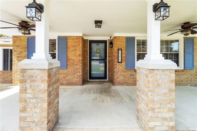 5213 Palmetto Ln, Fayetteville, NC 28304 - doorway to property featuring brick siding, ceiling fan, and covered porch