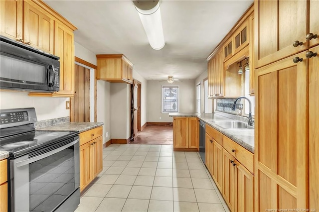5213 Palmetto Ln, Fayetteville, NC 28304 - kitchen featuring light tile patterned floors, glass insert cabinets, appliances with stainless steel finishes, a sink, and baseboards
