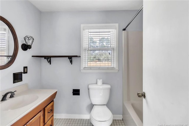 5213 Palmetto Ln, Fayetteville, NC 28304 - bathroom with toilet, tile patterned floors, vanity, and baseboards
