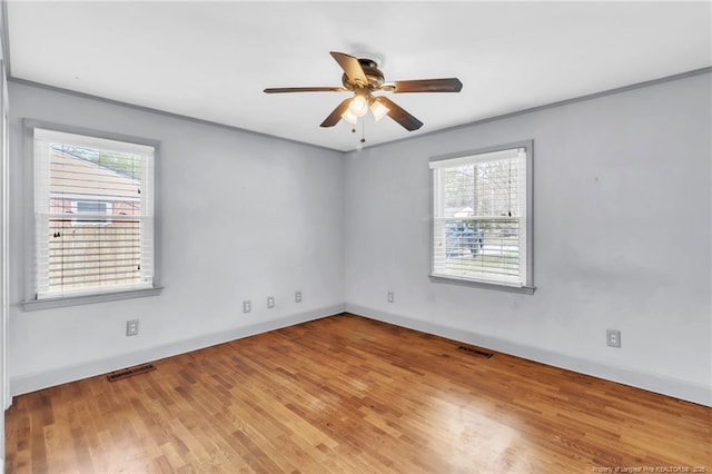 5213 Palmetto Ln, Fayetteville, NC 28304 - spare room featuring ceiling fan, visible vents, baseboards, and wood finished floors