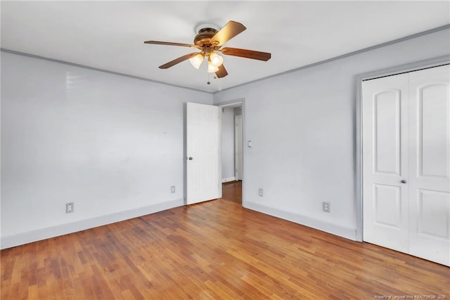 5213 Palmetto Ln, Fayetteville, NC 28304 - unfurnished bedroom with wood finished floors, ceiling fan, baseboards, and a closet