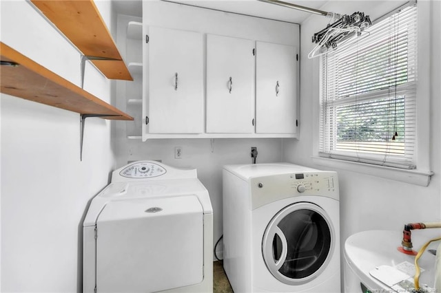 5213 Palmetto Ln, Fayetteville, NC 28304 - washroom featuring washer and dryer, cabinet space, and water heater