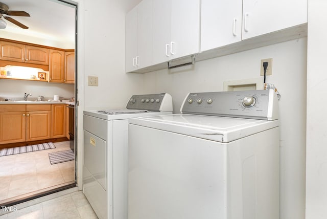 105 Elizabeth St, Chapel Hill, NC 27514 - clothes washing area featuring a sink, a ceiling fan, separate washer and dryer, light tile patterned floors, and cabinet space