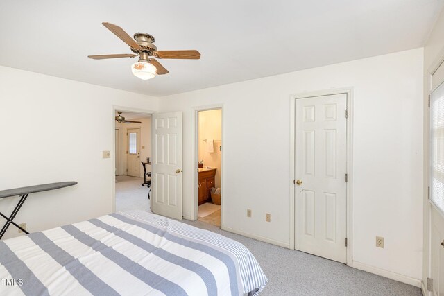 105 Elizabeth St, Chapel Hill, NC 27514 - bedroom featuring baseboards, ceiling fan, ensuite bathroom, and light carpet