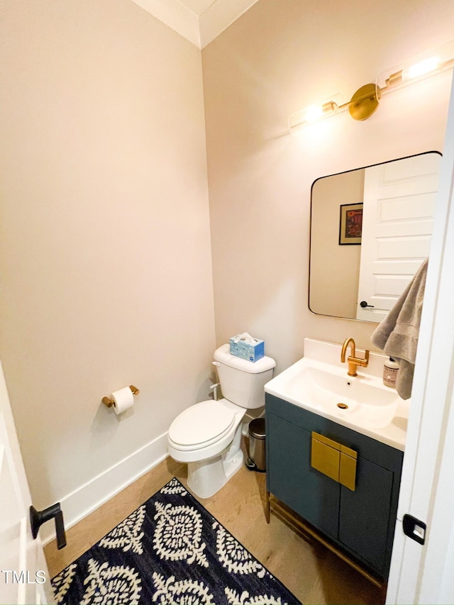14 Duck Bill Trl, Pittsboro, NC 27312 - bathroom featuring toilet, vanity, and baseboards