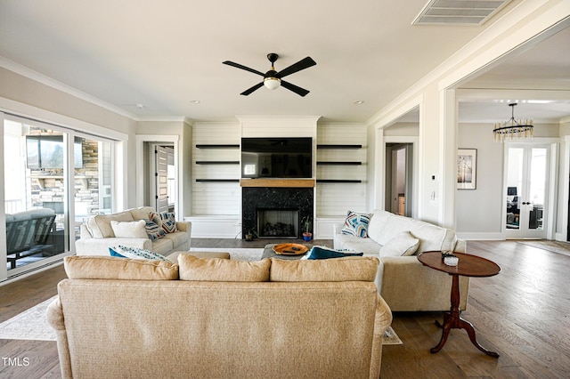 14 Duck Bill Trl, Pittsboro, NC 27312 - living area featuring ornamental molding, healthy amount of natural light, a high end fireplace, and dark wood finished floors
