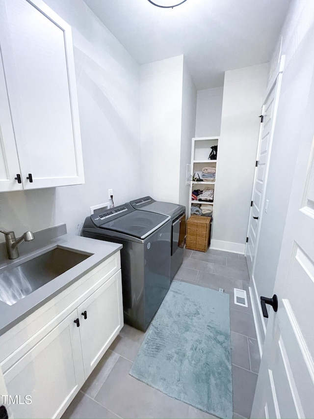 14 Duck Bill Trl, Pittsboro, NC 27312 - laundry area featuring cabinet space, separate washer and dryer, and light tile patterned flooring